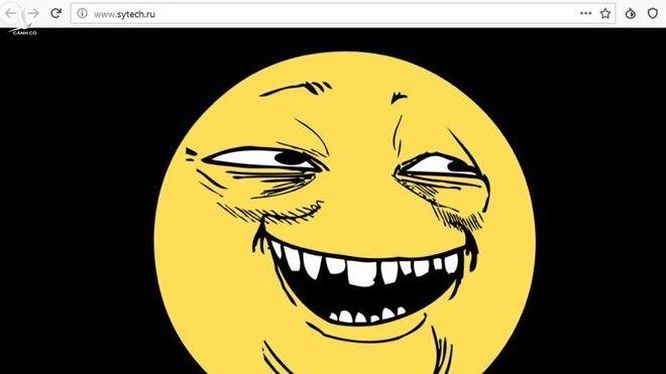 Hacker đã để lại khuôn mặt cười Yoba trên trang chủ của SyTech. Ảnh: Bleeping Computer 