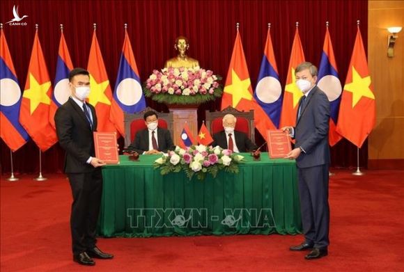 Tổng Bí thư hai nước Việt - Lào chứng kiến Lễ ký kết văn kiện hợp tác - 4