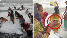Sông thiêng Ấn Độ đột nhiên nổi bọt trắng xóa: người dân lao vào tắm mặc mùi hôi thối