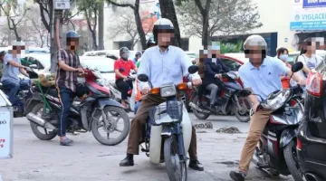 Những trường hợp nào đi xe máy trên vỉa hè không bị phạt tiền?