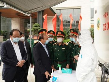 Quân và dân sát cánh chặn Covid-19 - Ảnh 1.