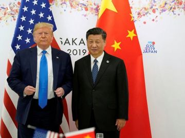 Ông Trump hoãn trừng phạt quan chức Trung Quốc vì sợ ảnh hưởng đàm phán thương mại - Ảnh 1.