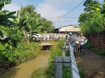 Hàng trăm người chui xuống cống tìm người phụ nữ bị nước cuốn ở Đồng Nai - Ảnh 6.