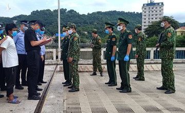 Bắt đối tượng người Trung Quốc bơi qua sông Hồng sang Việt Nam trốn truy nã - Ảnh 1.