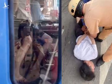 CSGT khống chế người đàn ông gí dao vào cổ tài xế xe buýt .