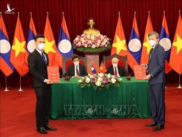 Tổng Bí thư hai nước Việt - Lào chứng kiến Lễ ký kết văn kiện hợp tác - 4